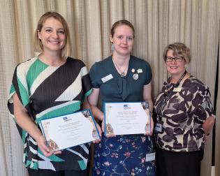 Sophie Netchaef (Powerhouse Museum) and Abbey Turrell and Kathryn Dan (ANU Archives) with the certificates of inscription for the Tooth and Company Collection.